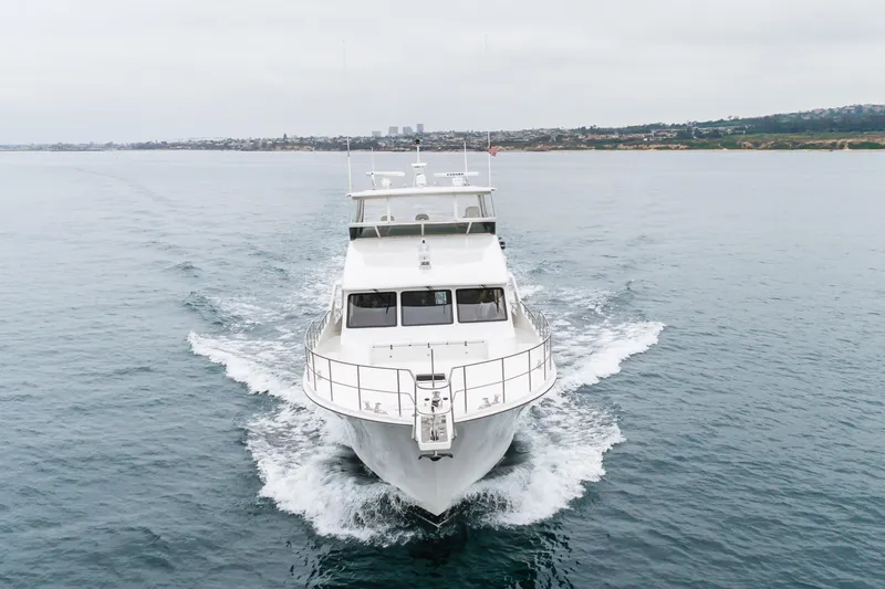 Slide: The Image of 2006 Cheoy Lee 72' Raised Pilot House yacht cruising on open water. - 57