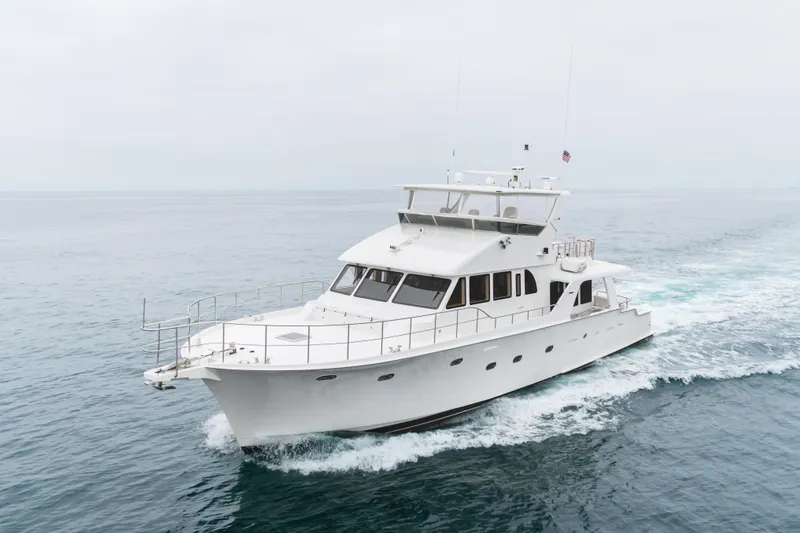 Slide: The Image of Luxury 2006 Cheoy Lee 72' Raised Pilot House yacht cruising on open sea. - 59
