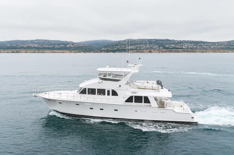 Slide: The Image of 2006 Cheoy Lee 72' Raised Pilot House yacht cruising on open water. - 63