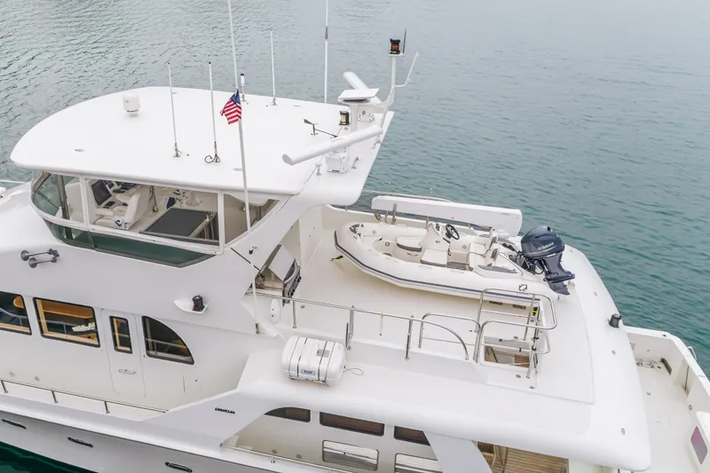 Slide: The Image of 2006 Cheoy Lee 72' Raised Pilot House yacht with upper deck and tender. - 67
