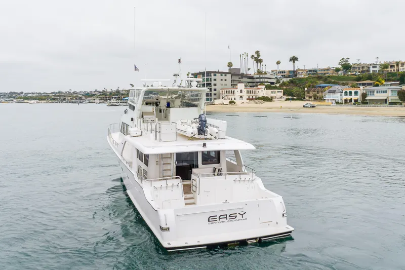 Slide: The Image of Luxury 2006 Cheoy Lee 72' Raised Pilot House yacht near scenic shoreline. - 69