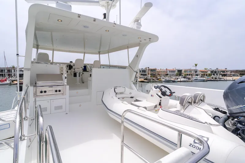 Slide: The Image of 2006 Cheoy Lee 72' Raised Pilot House yacht with spacious deck and tender boat. - 7