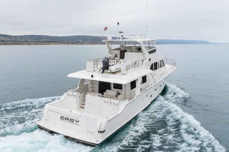 Slide: The Image of Luxury 2006 Cheoy Lee 72' Raised Pilot House yacht cruising on open water. - 71
