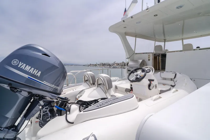Slide: The Image of 2006 Cheoy Lee 72' Raised Pilot House yacht with Yamaha outboard motor, docked in a marina. - 9