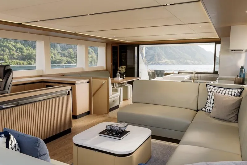Slide: The Image of Luxurious interior of 2026 ILIAD 60 yacht with modern furnishings and scenic views. - 5