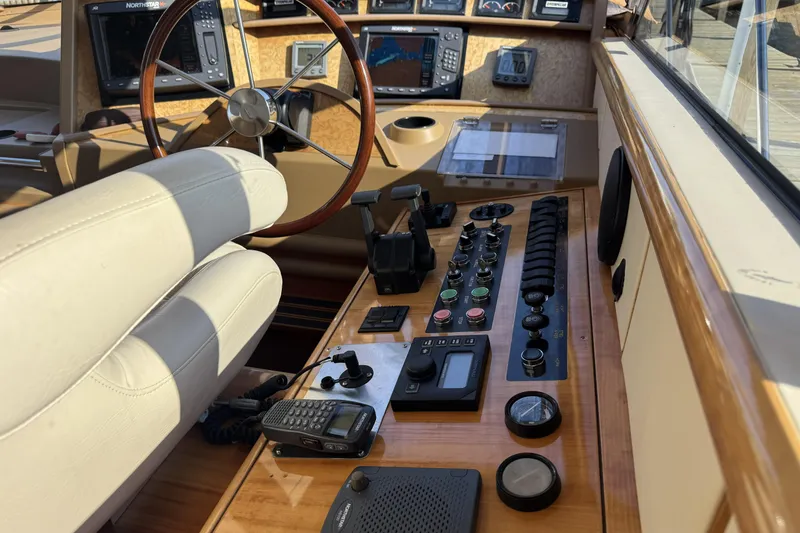 Slide: The Image of Helm of 2001 Neptunus 56 Express yacht with navigation controls and instruments. - 21