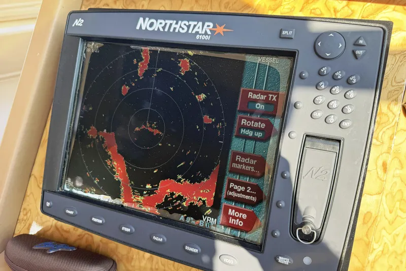 Slide: The Image of Northstar 6100i radar display on 2001 Neptunus 56 Express yacht dashboard. - 22