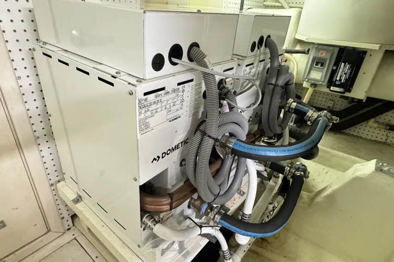 Slide: The Image of Engine room of 2001 Neptunus 56 Express with Dometic equipment and hoses. - 50