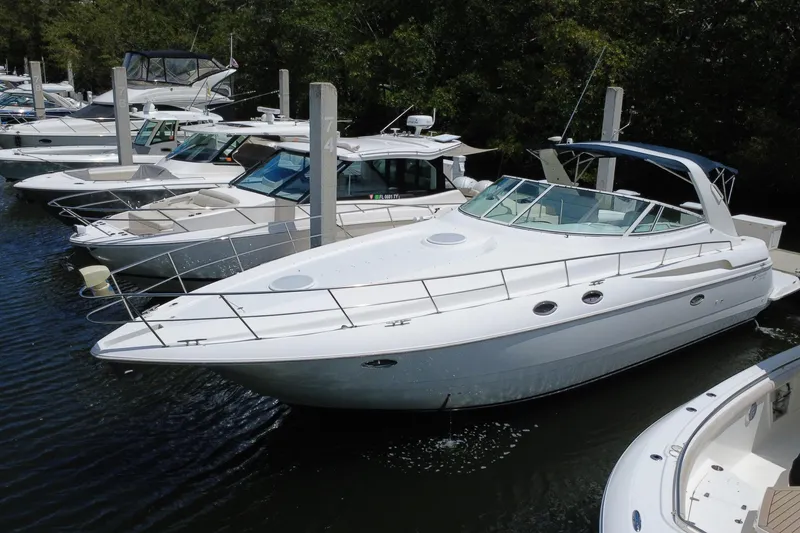 Slide: The Image of 1999 Cruisers Yachts 3870 Esprit docked among other boats in a marina. - 0