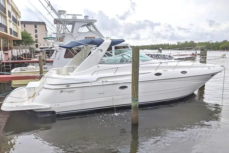 The Image of 1999 Cruisers Yachts 3870 Esprit docked, side view. - 1