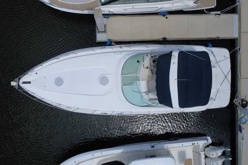 Slide: The Image of Overhead view of a 1999 Cruisers Yachts 3870 Esprit docked at a marina. - 14