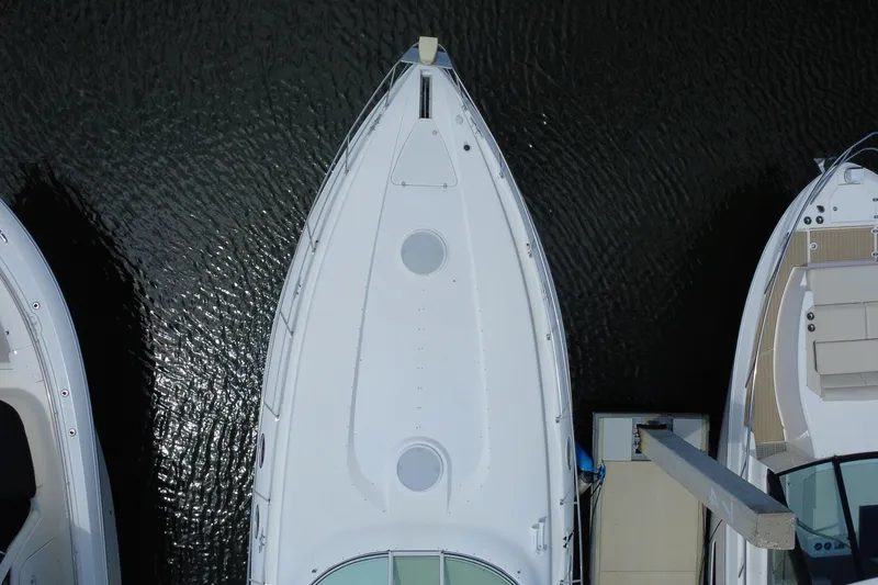 Slide: The Image of Aerial view of 1999 Cruisers Yachts 3870 Esprit docked on calm water. - 15