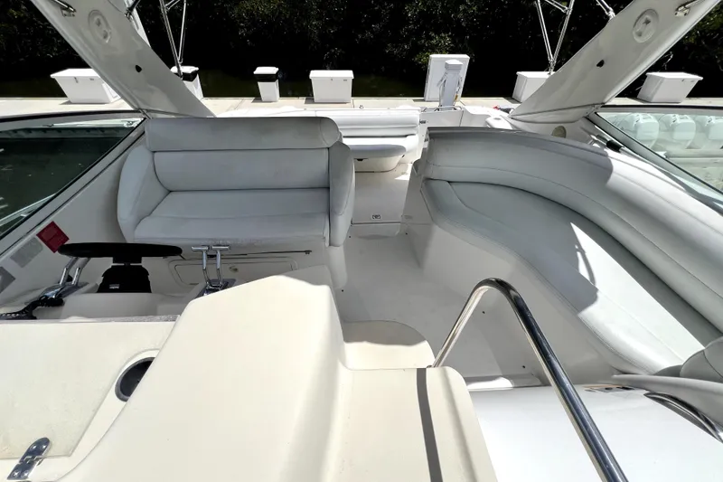 Slide: The Image of 1999 Cruisers Yachts 3870 Esprit interior with white seating and helm controls. - 23
