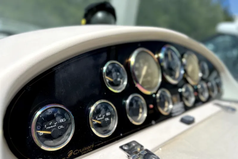 Slide: The Image of Dashboard of a 1999 Cruisers Yachts 3870 Esprit with various gauges and controls. - 27