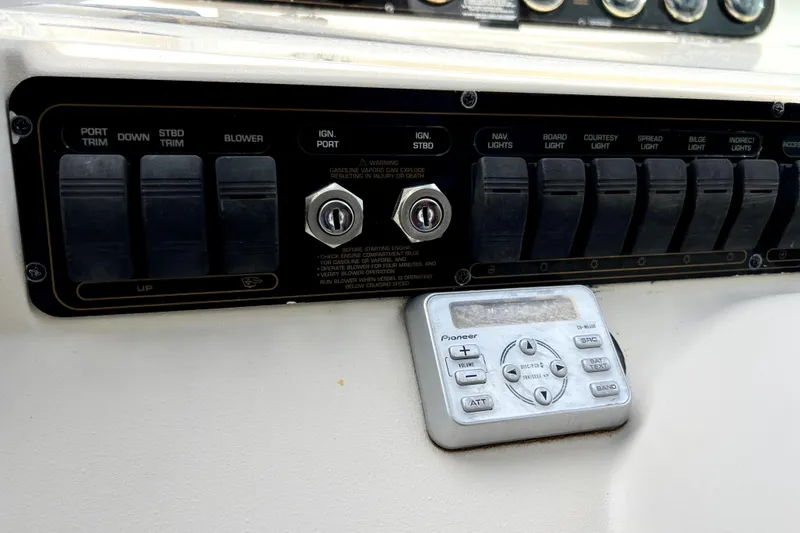 Slide: The Image of Control panel of a 1999 Cruisers Yachts 3870 Esprit with switches and Pioneer stereo. - 33