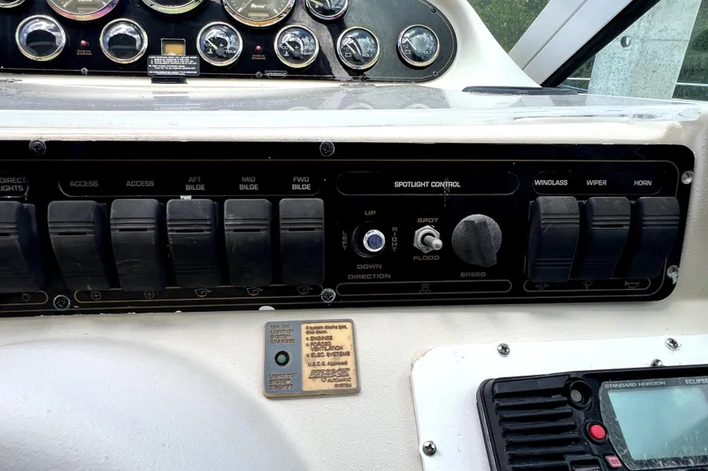 Slide: The Image of Control panel of a 1999 Cruisers Yachts 3870 Esprit with switches and gauges. - 34