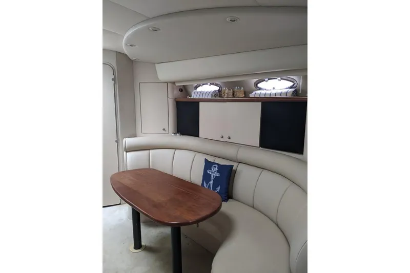 Slide: The Image of 1999 Cruisers Yachts 3870 Esprit docked, featuring sleek design and spacious deck. - 4