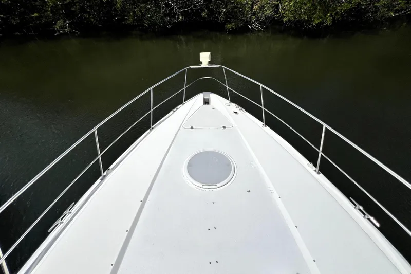 Slide: The Image of Bow view of 1999 Cruisers Yachts 3870 Esprit on calm water. - 41