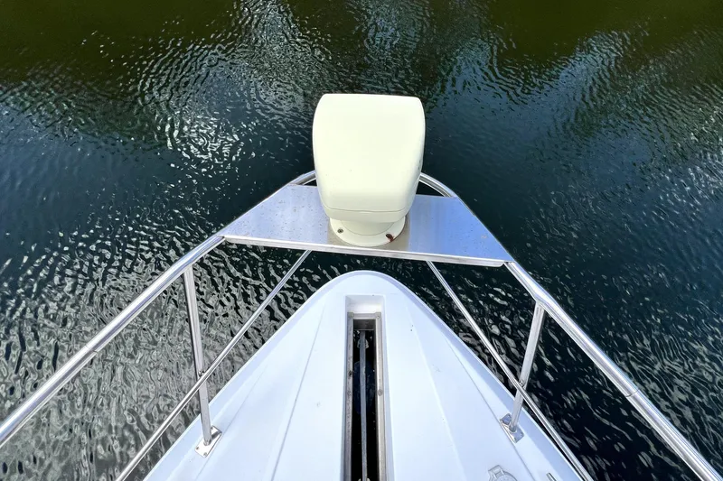 Slide: The Image of Bow view of 1999 Cruisers Yachts 3870 Esprit on calm water. - 42
