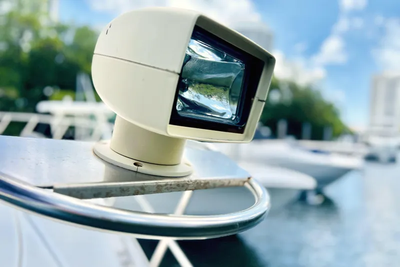 Slide: The Image of Close-up of spotlight on 1999 Cruisers Yachts 3870 Esprit, docked with blurred background. - 43