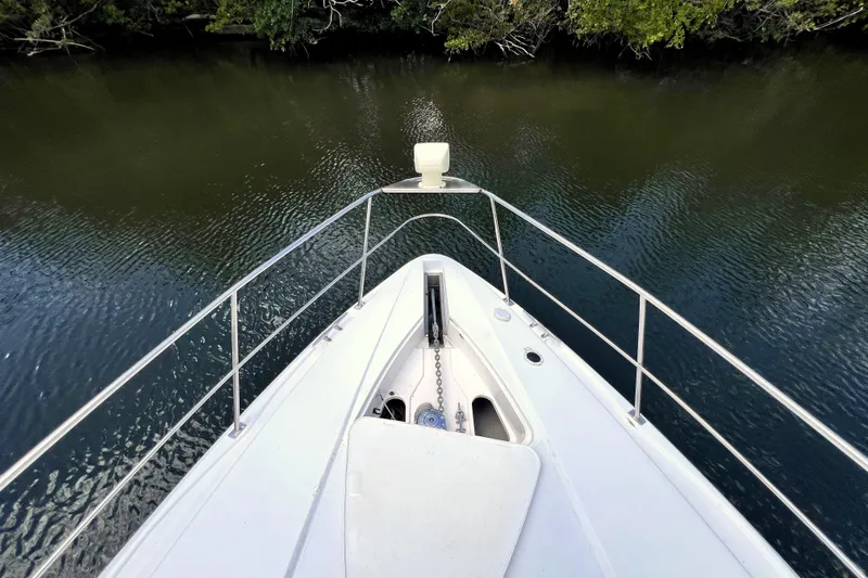Slide: The Image of Bow view of 1999 Cruisers Yachts 3870 Esprit on calm water. - 45
