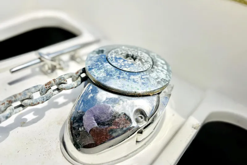 Slide: The Image of Close-up of a weathered anchor winch on a 1999 Cruisers Yachts 3870 Esprit. - 47