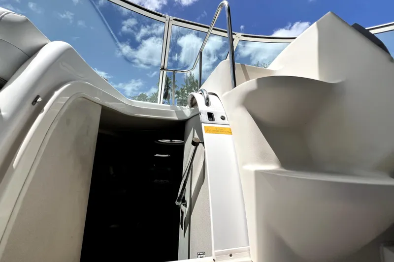 Slide: The Image of Stairway on 1999 Cruisers Yachts 3870 Esprit under a clear blue sky. - 54