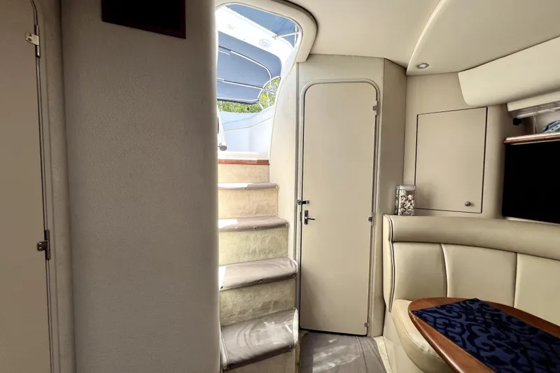 Slide: The Image of Interior of 1999 Cruisers Yachts 3870 Esprit with stairs and seating area. - 55