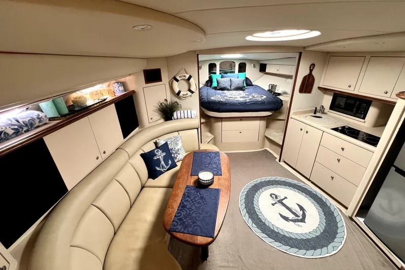 Slide: The Image of Luxurious interior of 1999 Cruisers Yachts 3870 Esprit with cozy seating and nautical decor. - 57