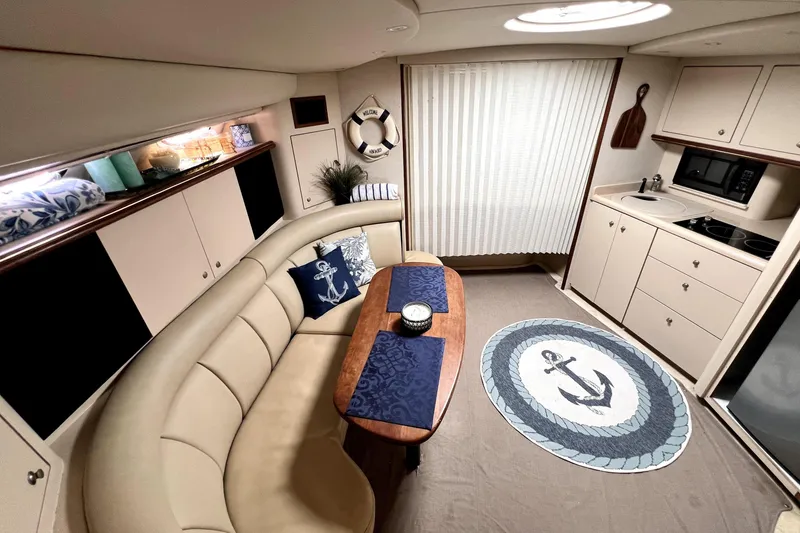 Slide: The Image of Luxurious interior of 1999 Cruisers Yachts 3870 Esprit with elegant seating and nautical decor. - 58