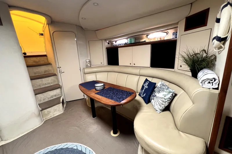 Slide: The Image of Luxurious interior of 1999 Cruisers Yachts 3870 Esprit with plush seating and elegant decor. - 63
