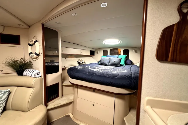 Slide: The Image of Luxurious 1999 Cruisers Yachts 3870 Esprit cabin with elegant bedding and cozy interior. - 71