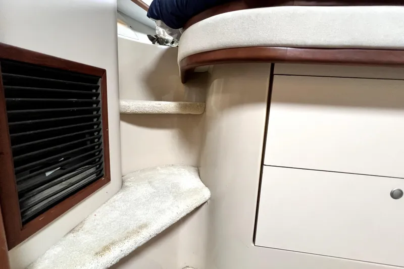 Slide: The Image of Interior of 1999 Cruisers Yachts 3870 Esprit with carpeted steps and wooden accents. - 72