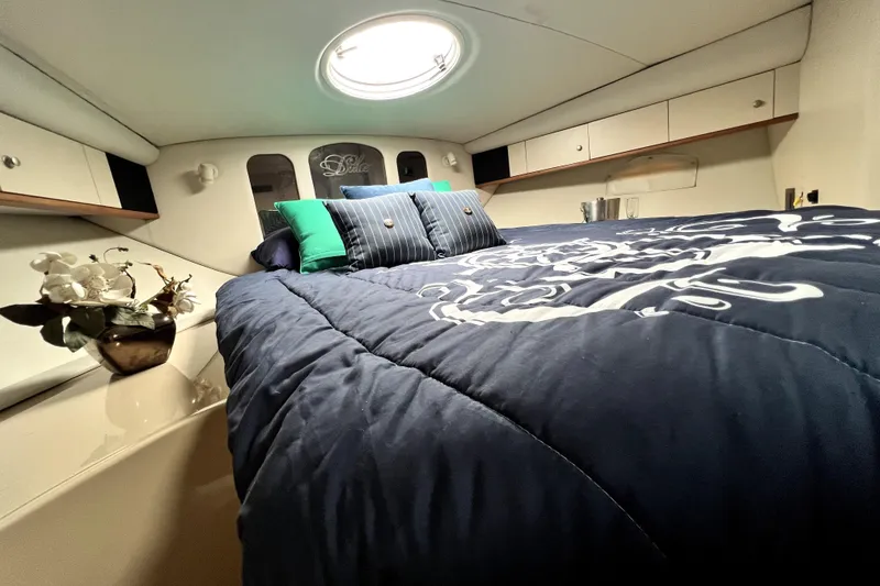 Slide: The Image of Luxurious cabin interior of 1999 Cruisers Yachts 3870 Esprit with elegant bedding. - 73