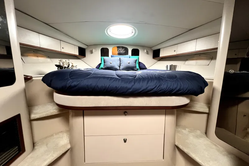 Slide: The Image of Luxurious cabin interior of 1999 Cruisers Yachts 3870 Esprit with plush bedding. - 74