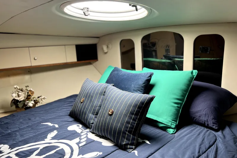 Slide: The Image of Luxurious cabin interior of 1999 Cruisers Yachts 3870 Esprit with plush bedding and decor. - 77