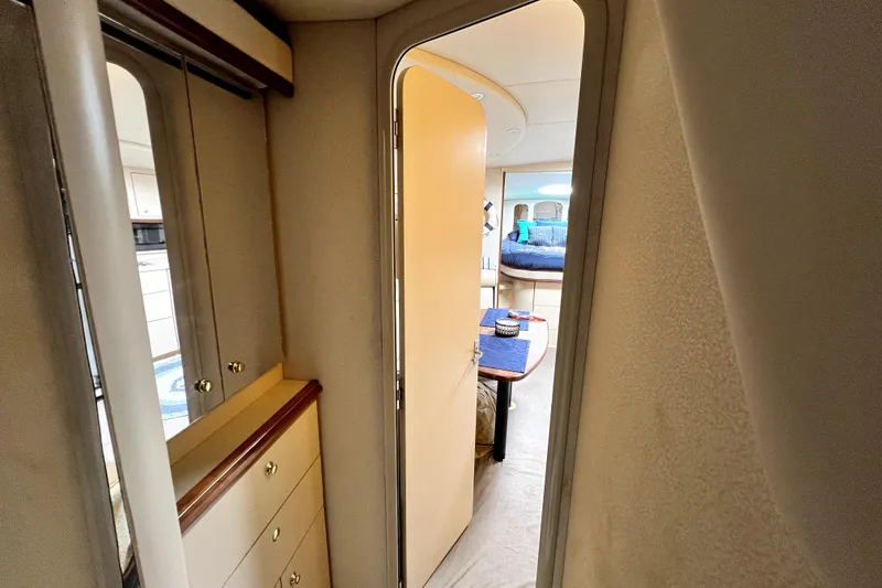 Slide: The Image of Interior view of 1999 Cruisers Yachts 3870 Esprit, featuring cozy cabin and dining area. - 78