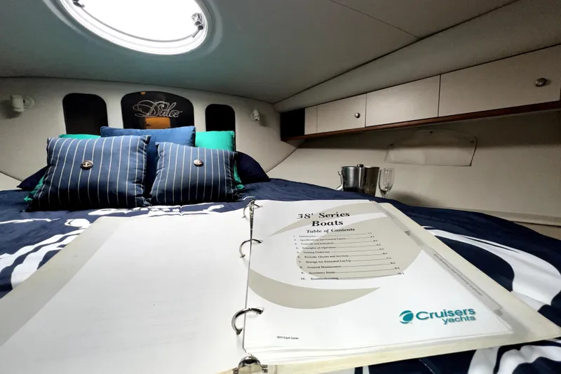 Slide: The Image of Luxurious cabin interior of 1999 Cruisers Yachts 3870 Esprit with manual and plush bedding. - 82