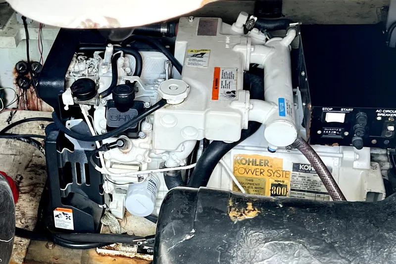 Slide: The Image of Engine compartment of a 1999 Cruisers Yachts 3870 Esprit with Kohler power system. - 85