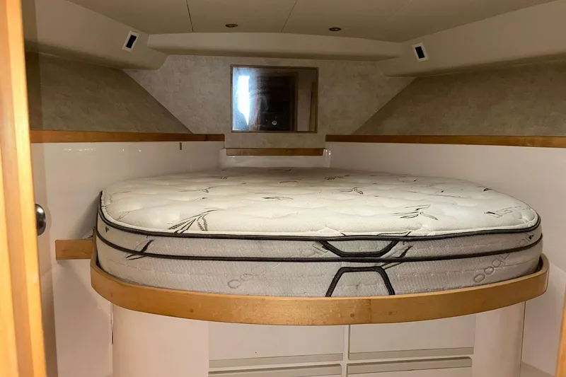 Slide: The Image of Interior cabin of a 1995 Bertram 43 Convertible yacht with a round bed. - 13