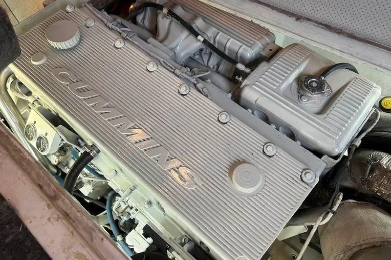 Slide: The Image of Cummins engine in a 1995 Bertram 43 Convertible boat, showcasing detailed components. - 23