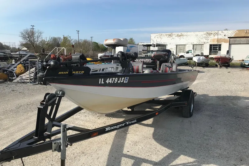 Slide: The Image of 2001 Ranger 217B Cherokee boat on trailer in outdoor lot. - 13