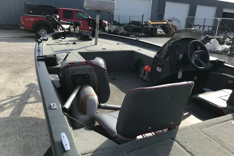 Slide: The Image of 2001 Ranger 217B Cherokee boat interior with steering console and seating. - 16