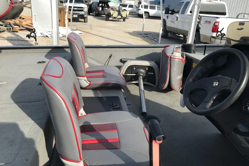Slide: The Image of Interior of a 2001 Ranger 217B Cherokee boat with gray and red seating. - 17