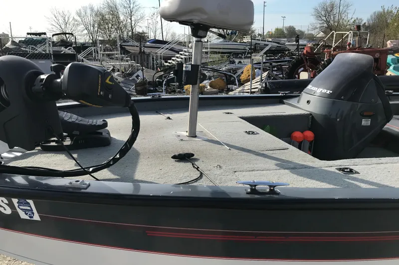 Slide: The Image of 2001 Ranger 217B Cherokee boat with motor and fishing equipment on deck. - 23