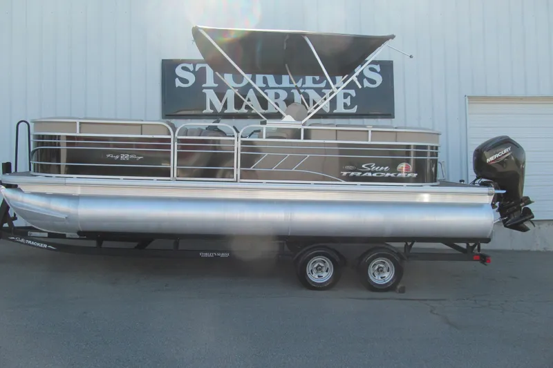 The Image of 2022 Sun Tracker Party Barge 22 DLX pontoon boat on trailer at dealership. - 1