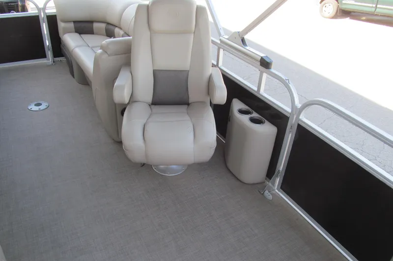 Slide: The Image of 2022 Sun Tracker Party Barge 22 DLX interior with plush seating and cup holders. - 12