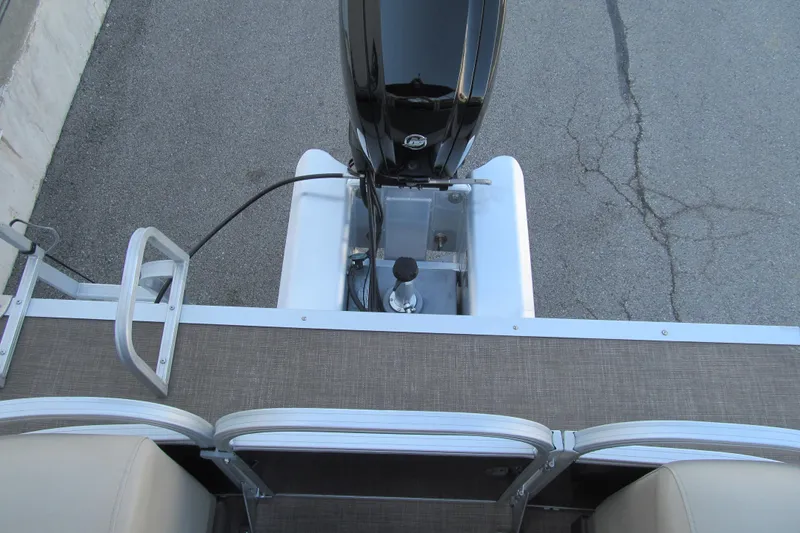 Slide: The Image of 2022 Sun Tracker Party Barge 22 DLX rear view with motor and deck details. - 15