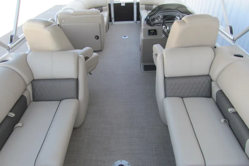 Slide: The Image of 2022 Sun Tracker Party Barge 22 DLX interior with luxurious seating and modern dashboard. - 5