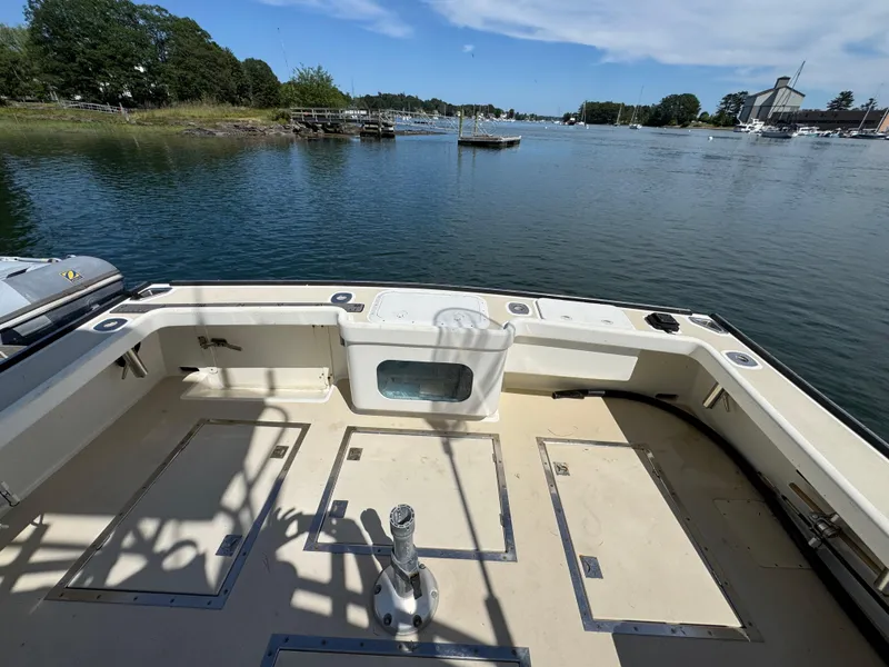Slide: The Image of Northern Bay 36 boat deck, 2009 model, overlooking serene waters and lush greenery. - 15